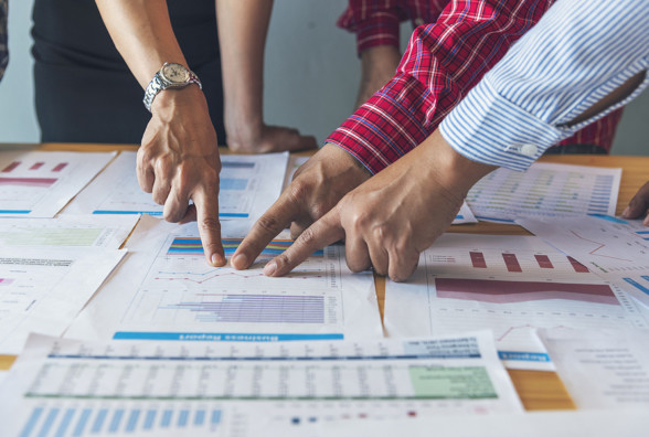 increase the value of your business, reviewing performance charts with a manager